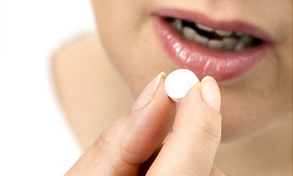 woman-taking-pill